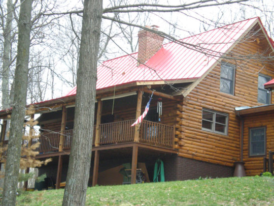 Deep Red Log Cabin Standing Seam Metal Roof