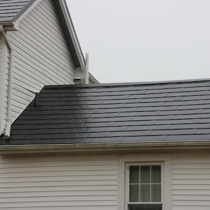 new metal roof with grey sky in background